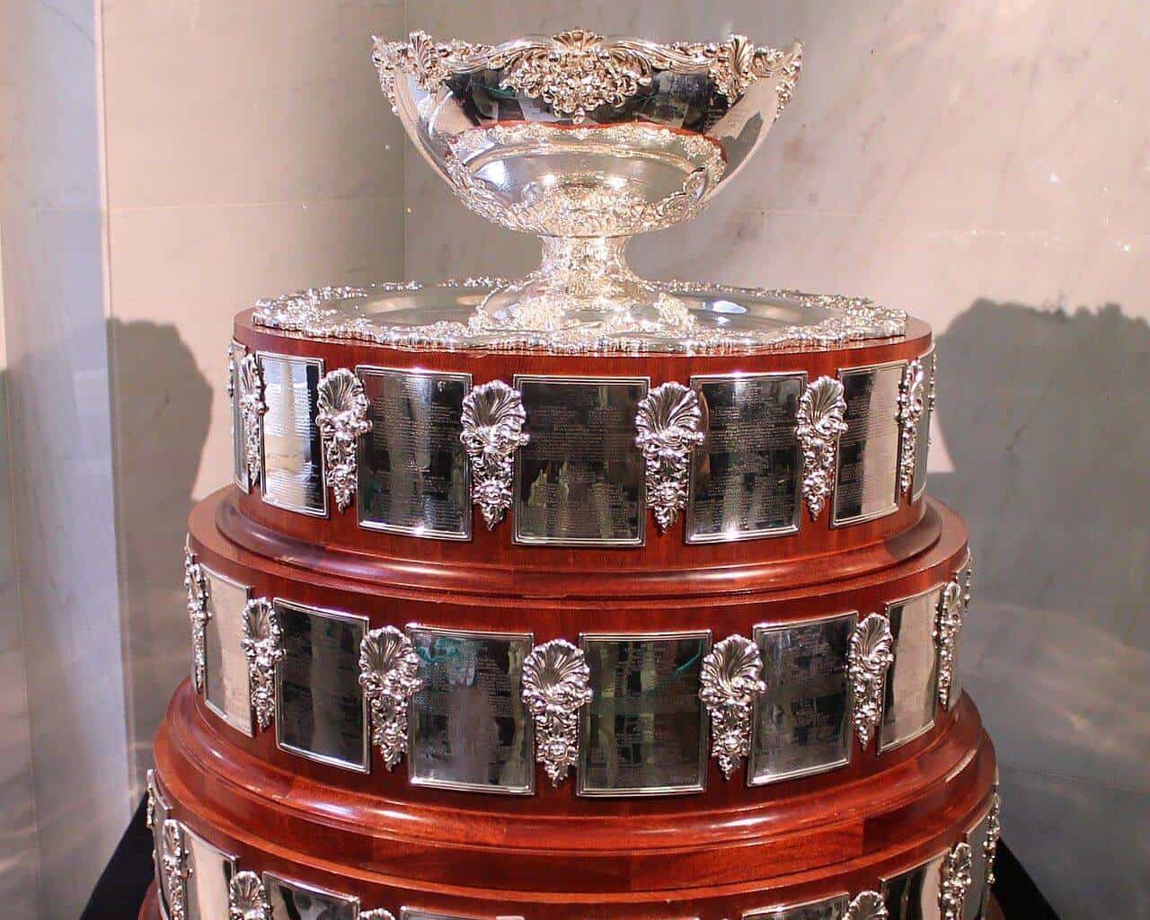 The silver Davis Cup trophy with its tiered wooden and silver base on display