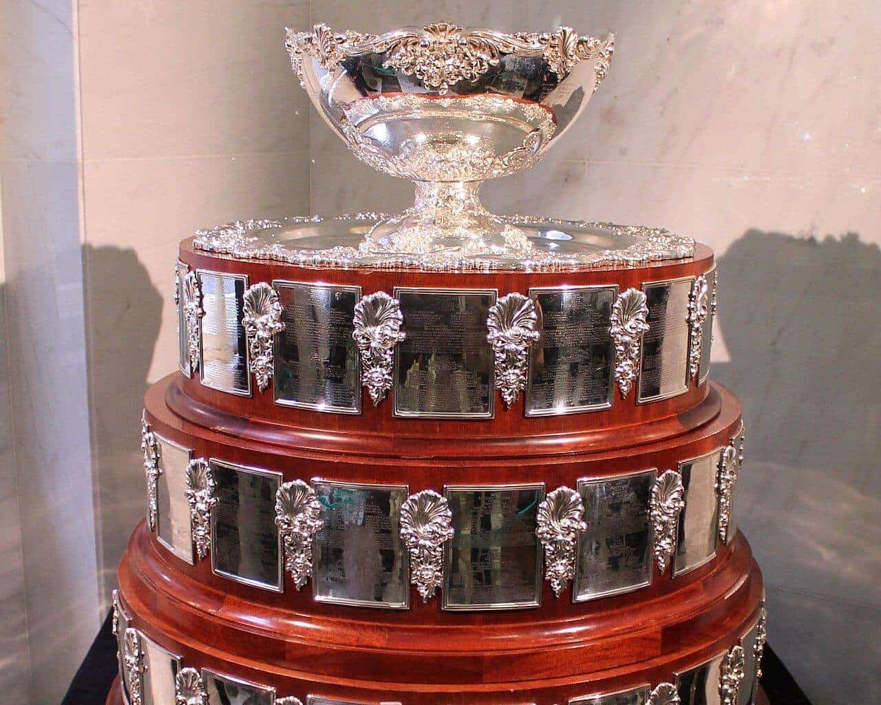 The silver Davis Cup trophy with its tiered wooden and silver base on display